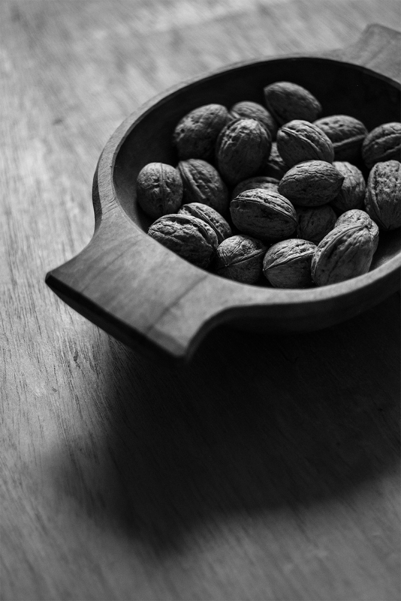 Walnuts in a hand carved wooden bowl black and white still life portrait photograph P. Maton 2017 eyeteeth.net